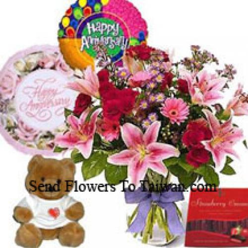 Fleurs assorties avec mignon ours en peluche et chocolats importés